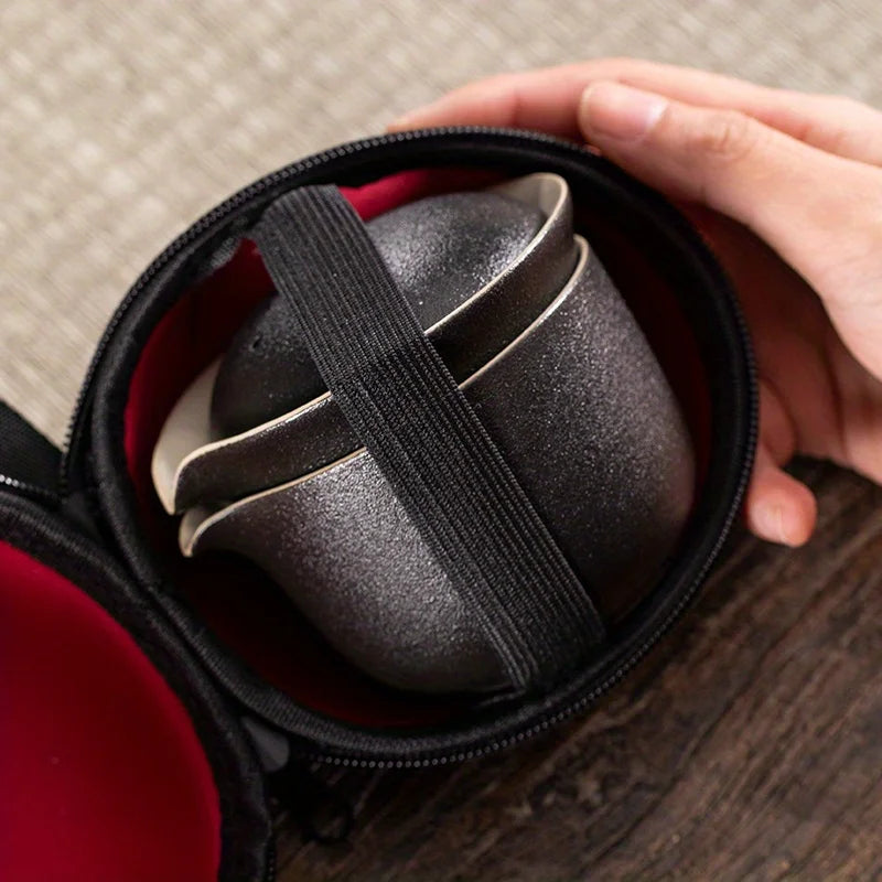 A set of exquisite ceramic tea ware, suitable for outdoor camping and home use, with a portable teapot.