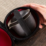 A set of exquisite ceramic tea ware, suitable for outdoor camping and home use, with a portable teapot.