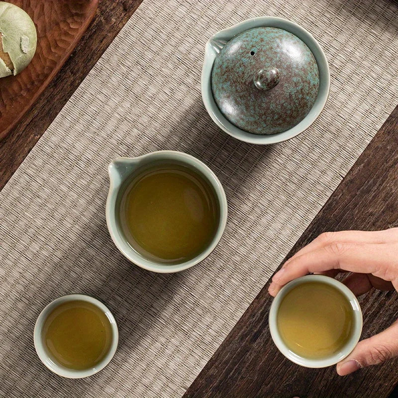 A set of exquisite ceramic tea ware, suitable for outdoor camping and home use, with a portable teapot.