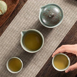 A set of exquisite ceramic tea ware, suitable for outdoor camping and home use, with a portable teapot.