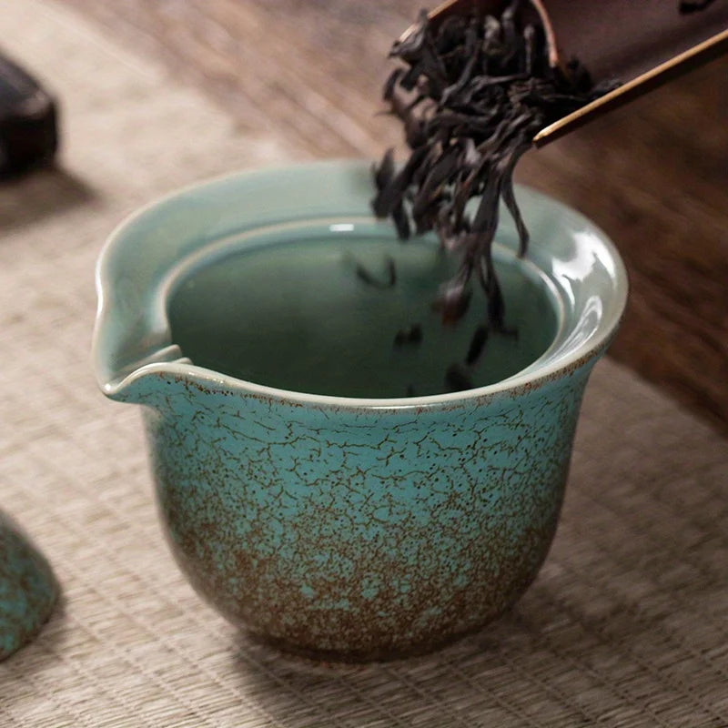 A set of exquisite ceramic tea ware, suitable for outdoor camping and home use, with a portable teapot.