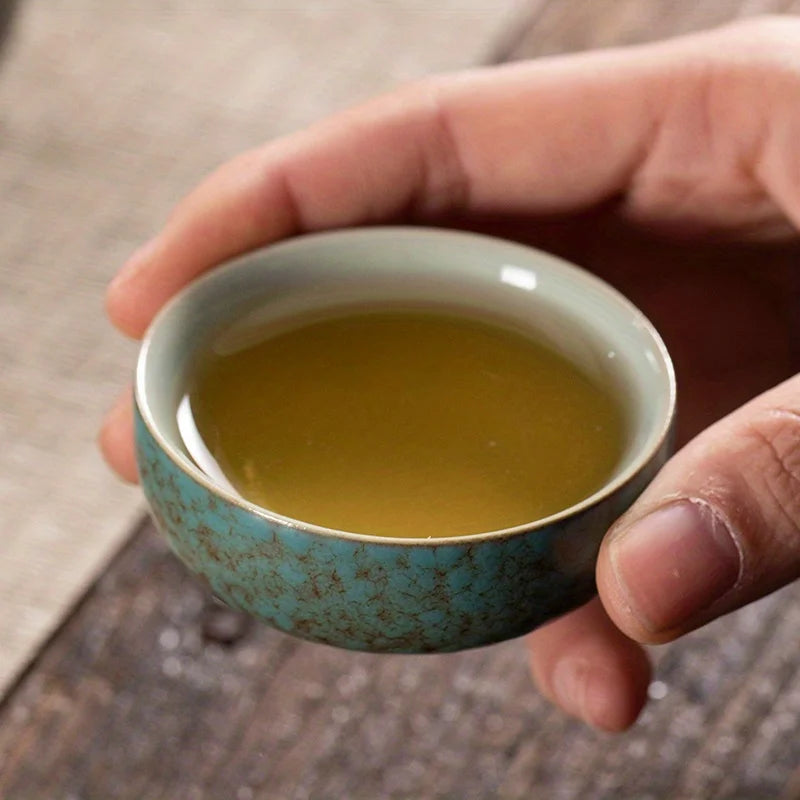 A set of exquisite ceramic tea ware, suitable for outdoor camping and home use, with a portable teapot.