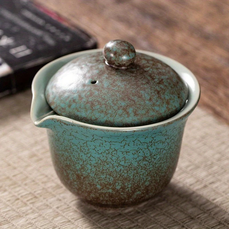A set of exquisite ceramic tea ware, suitable for outdoor camping and home use, with a portable teapot.