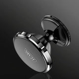 The magnetic dashboard is glued to the car mount for mobile phone navigation