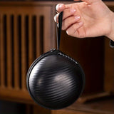 A set of exquisite ceramic tea ware, suitable for outdoor camping and home use, with a portable teapot.
