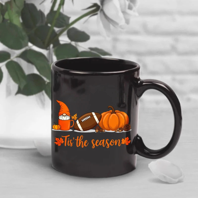 A black Egyptian temple designed ceramic cup with hieroglyphics and columns is suitable for drinking coffee, tea, or water at ho