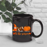 A black Egyptian temple designed ceramic cup with hieroglyphics and columns is suitable for drinking coffee, tea, or water at ho