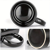 A black Egyptian temple designed ceramic cup with hieroglyphics and columns is suitable for drinking coffee, tea, or water at ho